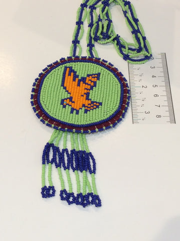 Bird medallion with beaded necklace