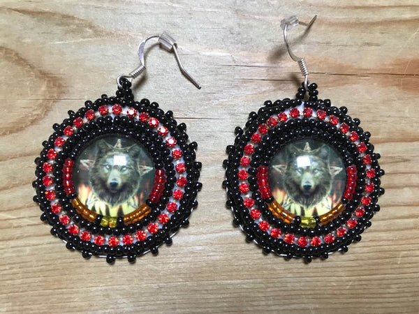 Beaded earrings with Wolf cabs by Rachel Panamick - created offsite